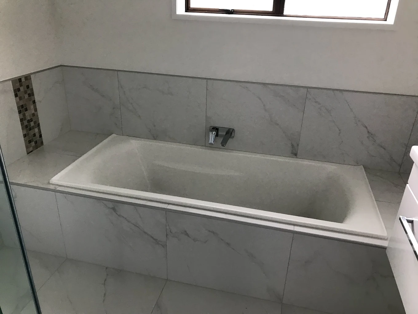 Freestanding marble bathtub installation